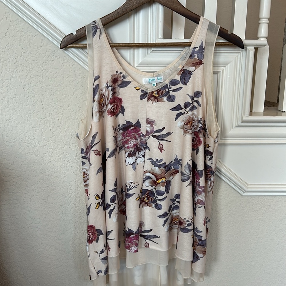Flowy and Floral tank top with an antiqued looking under layer.
